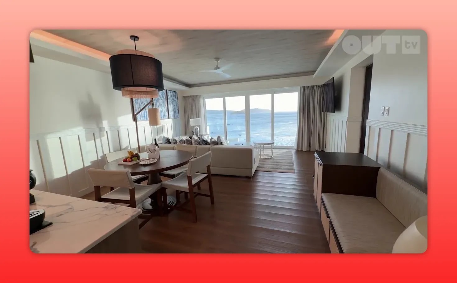 Secrets St. Lucia suite living and dining area with ocean view windows